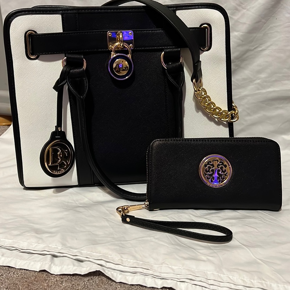 A nice black and white bag with some gold